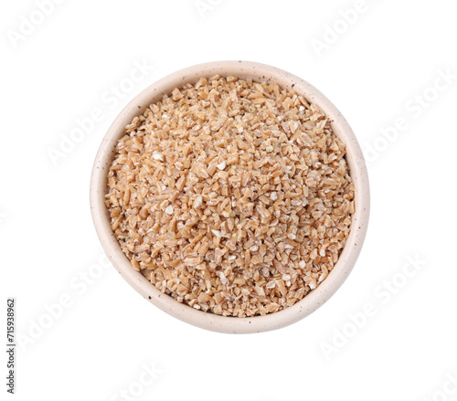 Dry wheat groats in bowl isolated on white, top view