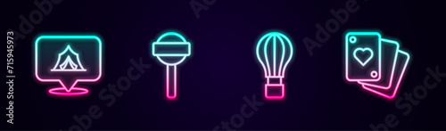 Set line Circus tent, Lollipop, Hot air balloon and Playing cards. Glowing neon icon. Vector photo