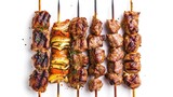Grilled meat skewers variety isolated on white, Souvlaki chicken and pork, kebab doner. Greek grill food, top view. Design element