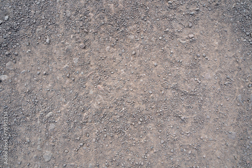 Background with gravel stones on a gravel road photo