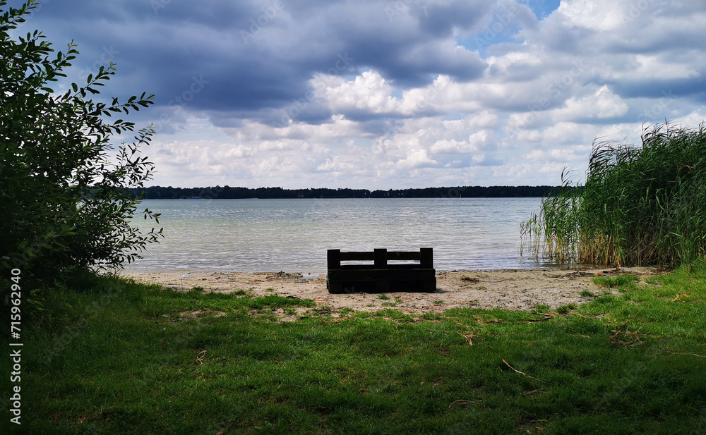 great shots of the calm Arendsee with boats and benches