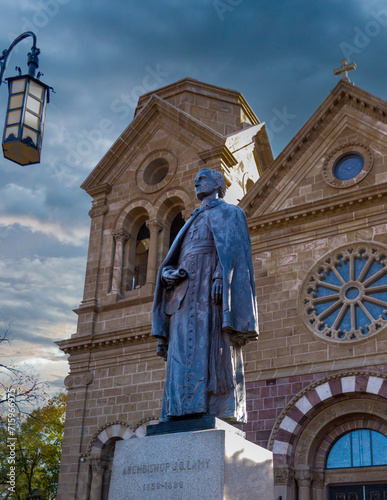SANTA FE, NEW MEXICO,  USA - NOV 13, 2015: A bronze statue of the first Archbishop of Santa Fe, New Mexico, Archbishop Jean Baptiste Lamy in front of the Cathedral Basilica of St. Francis.