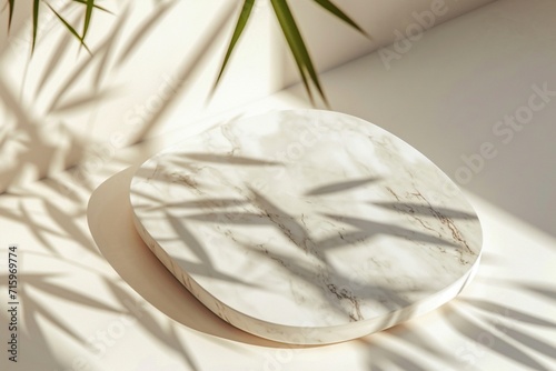Marble oval board with shadow of plants on a light background for product demonstration. Trendy neutral aesthetic layout template for beauty and cosmetics scene