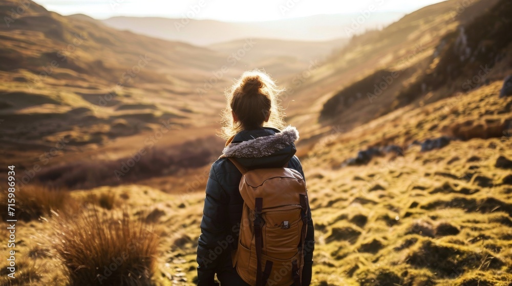 Person stood on a cliff overlooking the sea Person stood on a cliff overlooking the sea