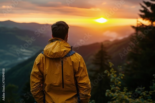 Man on Mountain Top at Sunset