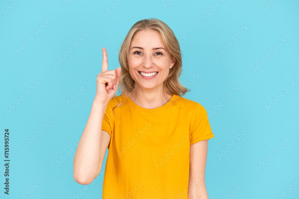 Woman pointing up with index finger, have idea Woman pointing up with index finger, have idea