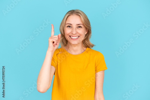 Woman pointing up with index finger, have idea