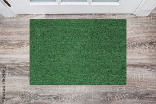 Green Coir Doormat on a wooden floor in front of the door. Product mockup