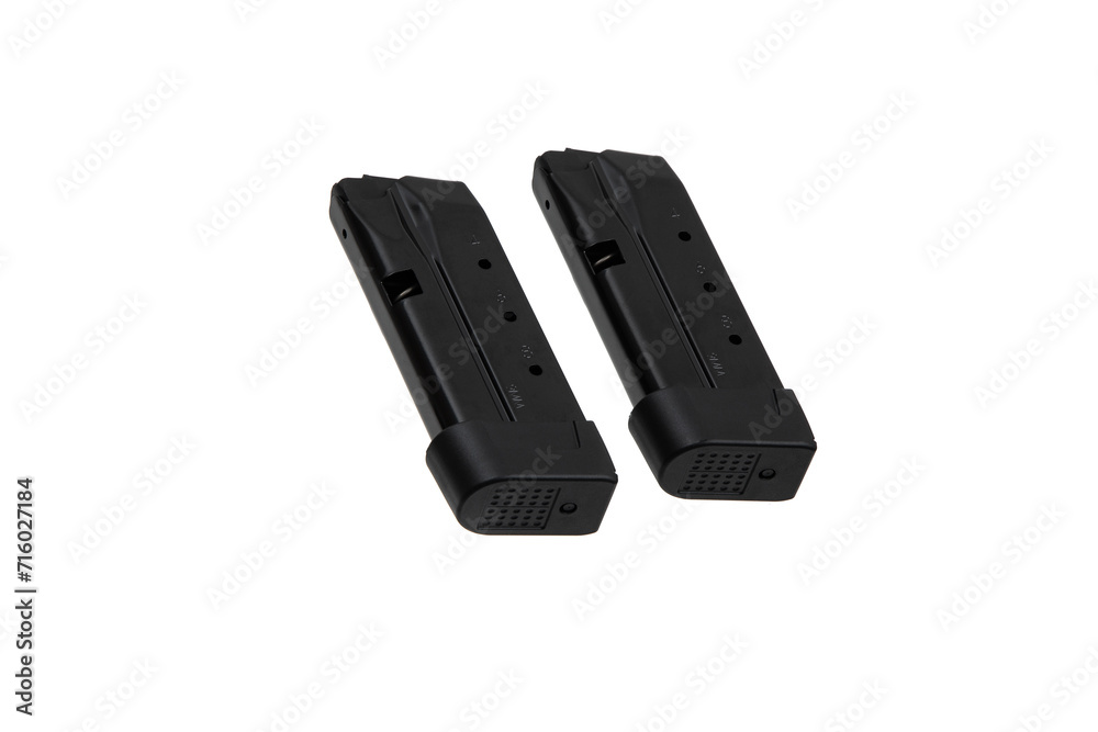Metal pistol magazine for 9 mm cartridges. Clip for ammunition. Isolate on a white back. Metal pistol magazine for 9 mm cartridges. Clip for ammunition. Isolate on a white back.