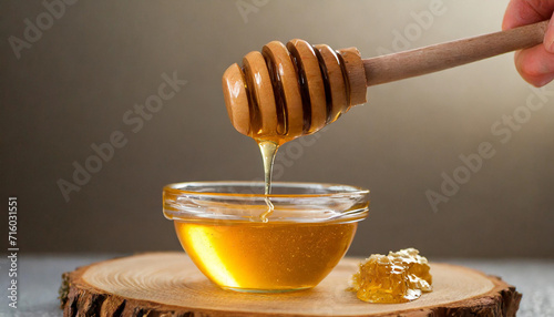 Golden honey drips from a dipper, symbolizing health and sweetness, a tempting visual of natural goodness