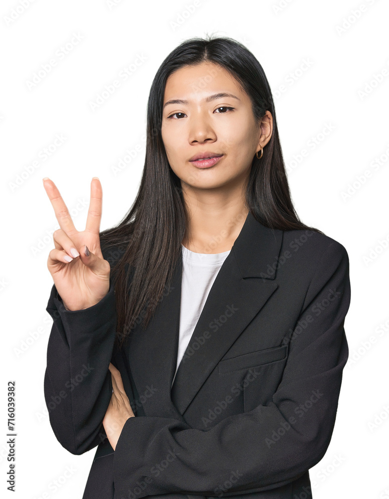 Young Chinese woman in business suit showing number two with fingers. Young Chinese woman in business suit showing number two with fingers.