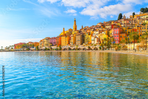Townscape of the picturesque and colorful old town and Les Sablettes Beach and promenade along the Cote d'Azur French Riviera at Menton, France. photo
