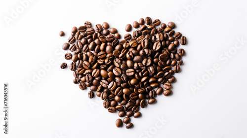 Coffee beans artfully arranged to form a heart shape on a white background. Charming and visually pleasing composition for coffee enthusiasts.