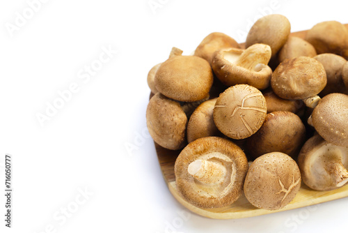 Fresh shiitake mushrooms on white background.