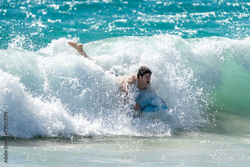 boogie boarding and playing in the water at Poipu beach