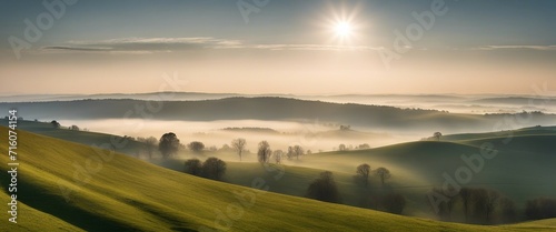 Panorama of Rolling Hills in Mist, a wide panoramic shot of rolling hills shrouded in morning mist