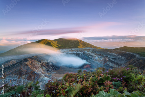 Sunrise over the crater with smoke, Poas volcano, Costa Rica photo