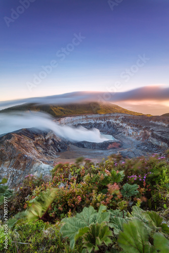 Sunrise over the crater with smoke, Poas volcano, Costa Rica photo