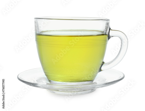 Fresh green tea in glass cup and saucer isolated on white