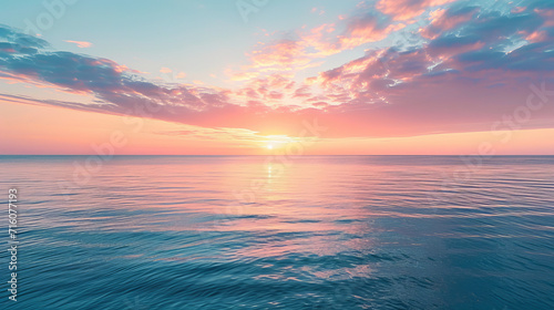 Peaceful sunrise over a tranquil ocean with pastel skies