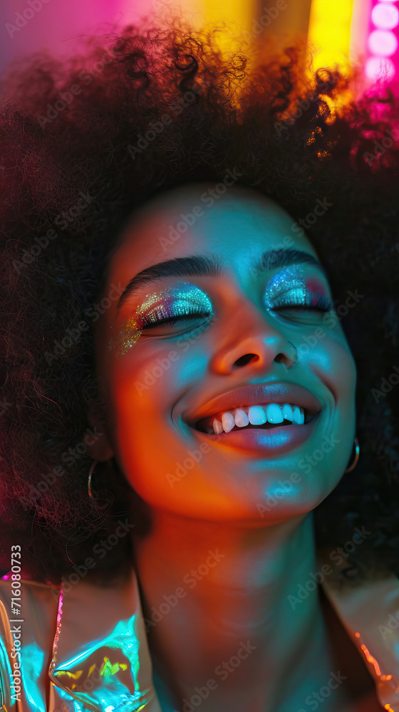 Radiant Joy: A Close-Up of a Joyful Young Woman with Afro Hair, Captured in a Vivid and Colorful Portrait, Illuminated by Soft, Bright Light