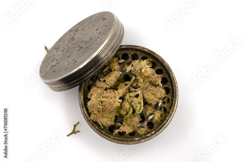 Cannabis nuggets in metal grinder