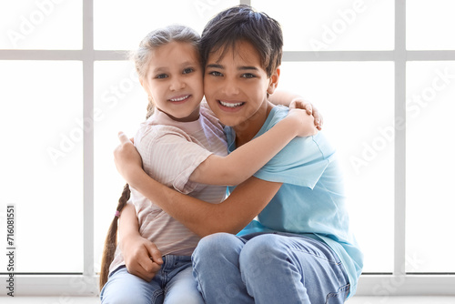Little boy with his sister ...