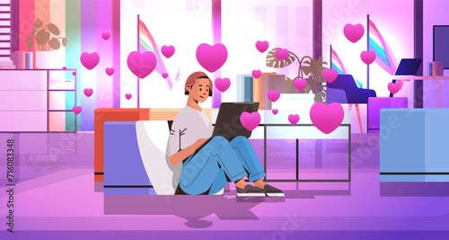 girl in love using laptop social media communication happy valentines day celebration concept living room interior with pink hearts