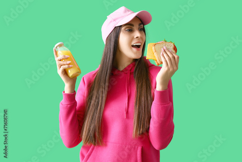 Young woman with tasty sand...