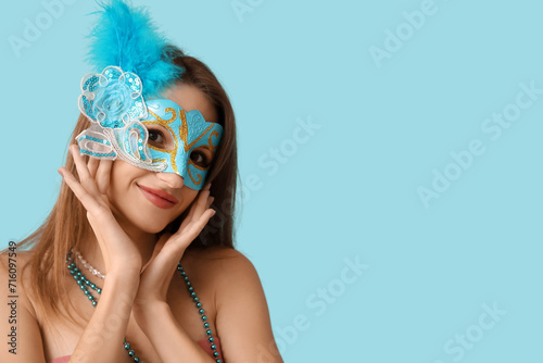 Young woman wearing blue ca...