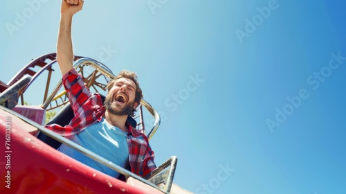 Happy young man on roller coaster