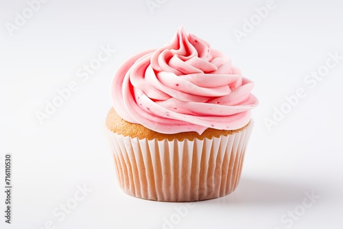 Strawberry frosting swirls on a cupcake white background shallow depth of field