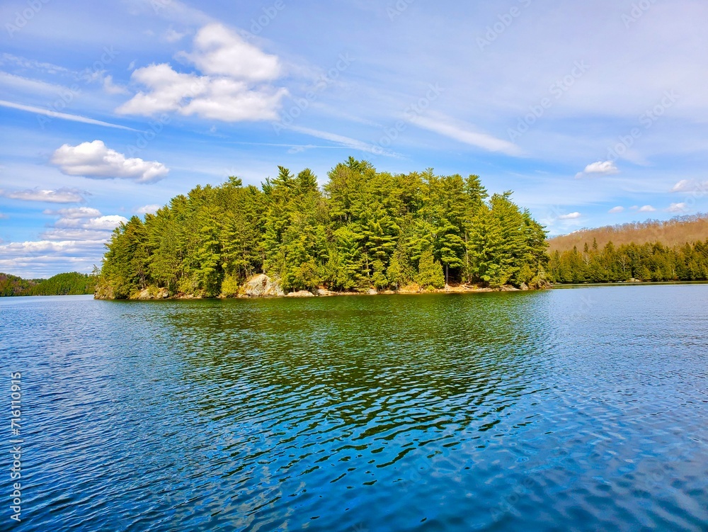 Fototapeta premium Beautiful sceneries while boating or fishing, small islands everywhere… 31 Mile Lake, Gracefield, Quebec, Canada