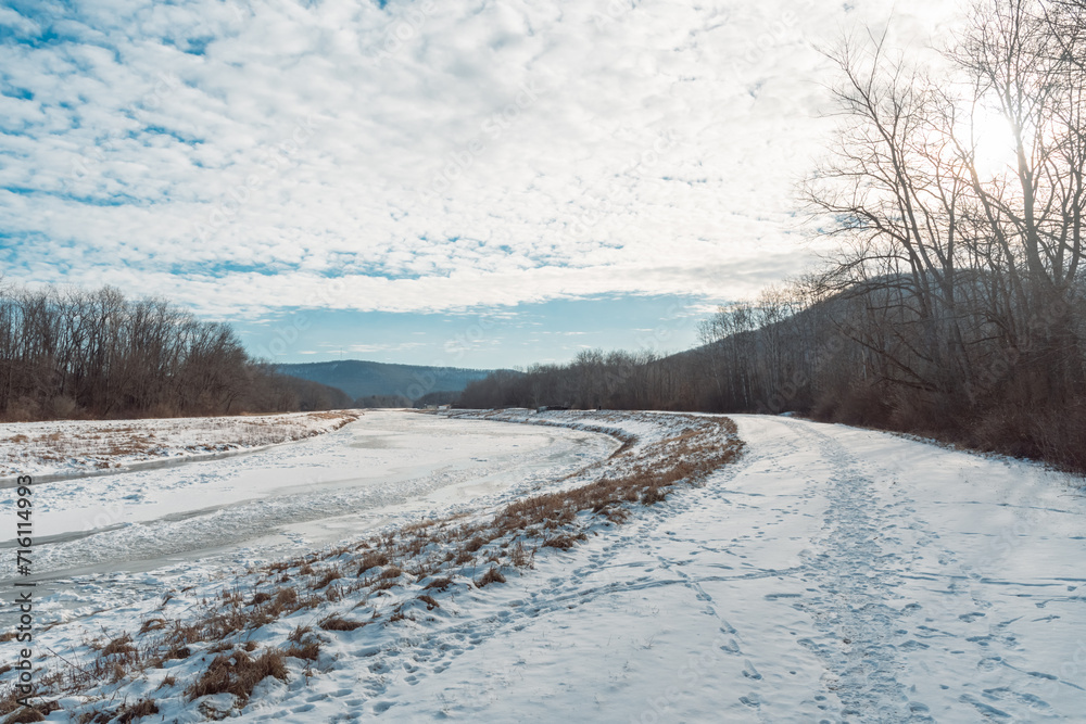Frozen over river extreme cold weather copy space winter landscape background Frozen over river extreme cold weather copy space winter landscape background