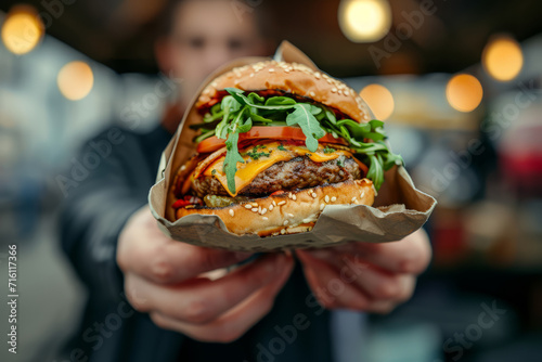 A fast food street food vendor with a freshly made cheeseburger photo