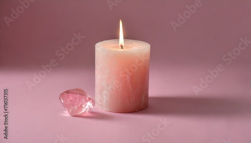Pale pink candle and crystals