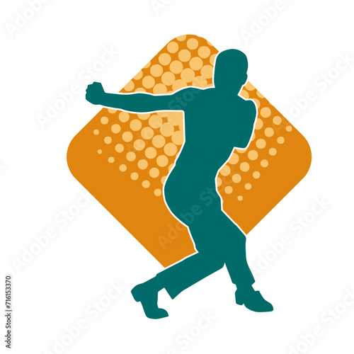 Silhouette of a man in oriental martial art pose. Silhouette of a male in martial art move.