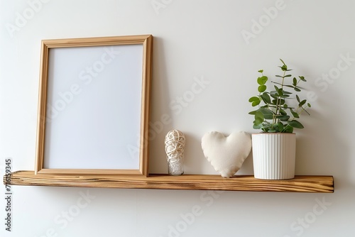 Mock up wood frame with Valentines Day heart decor and calendar. Wood shelf against a white wall. Copy space.