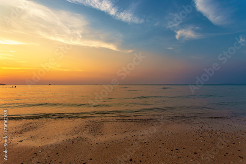 Beautiful summer beach and sea and yellow orange sky at the sunset  twilight period which including of sunrise