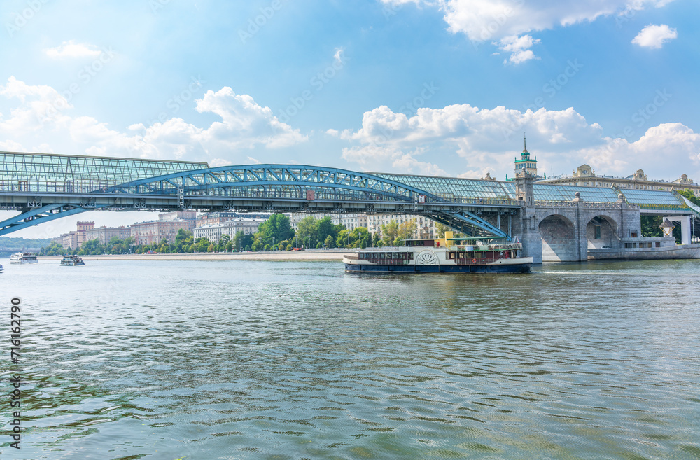 Fototapeta premium View of the Moscow river embakment, Pushkinsky bridge and cruise ships at sunset.