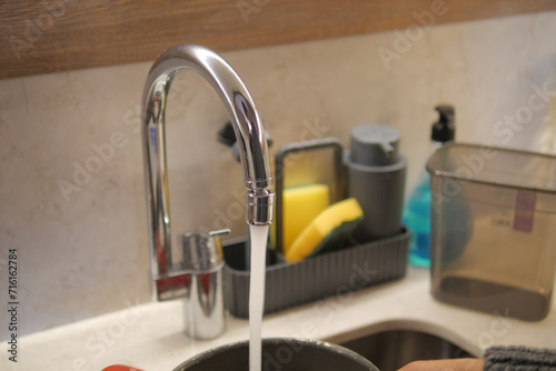 water pouring from a faucet tap slow motion 