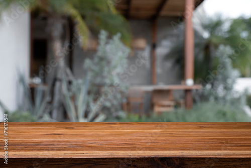 Wood table space over blur background of cafe restaurant. © kongpith