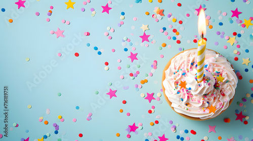 A sweet and festive dessert adorned with vibrant sprinkles and a luscious layer of white frosting, perfect for any birthday celebration or party gathering