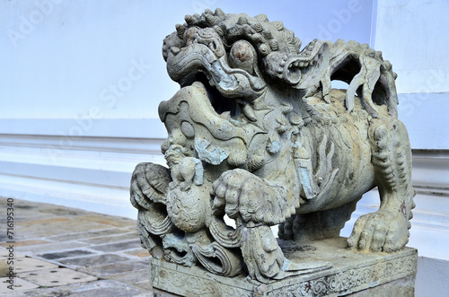 The statue of the ancient lion is the symbol of the guardian who protect the religious place.