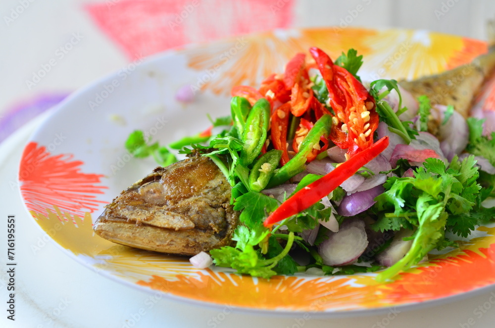 The fried salted mackerel with coriander and red pepper set for meal. The fried salted mackerel with coriander and red pepper set for meal.