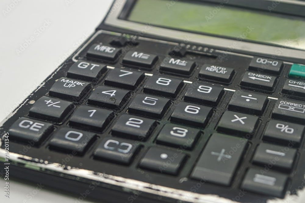 a black calculator isolated on white background. perfect for Education, mathematics, and Business Article or Content. a black calculator isolated on white background. perfect for Education, mathematics, and Business Article or Content.