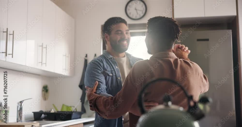 Happy man, gay and dancing in kitchen for love, support or trust in embrace, weekend or holiday together at home. Young male couple or lovers smile in slow dance for LGBTQ, pride or bonding at house Happy man, gay and dancing in kitchen for love, support or trust in embrace, weekend or holiday together at home. Young male couple or lovers smile in slow dance for LGBTQ, pride or bonding at house