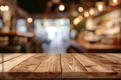 wood table on blur of cafe, coffee shop, bar, background - can used for display or montage your products © Дмитрий Баронин