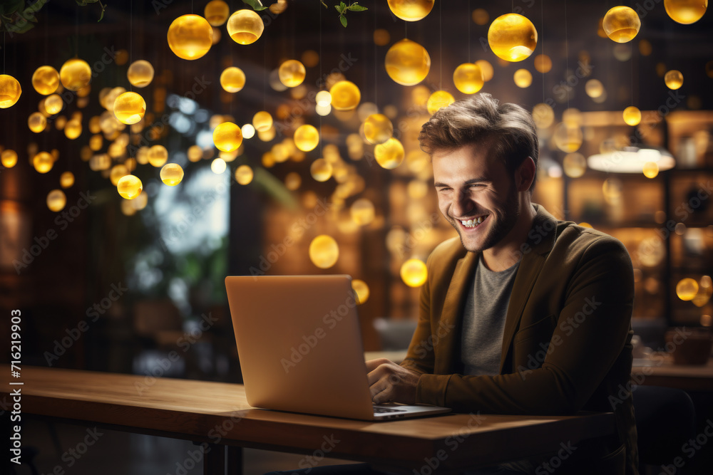 Man sitting at table, working on laptop computer. This image can be used to illustrate technology, remote work, or business concepts Man sitting at table, working on laptop computer. This image can be used to illustrate technology, remote work, or business concepts