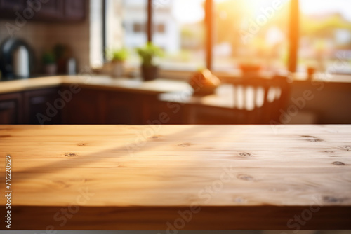 Wooden table placed in front of window, providing scenic view. This image can be used to depict cozy and inviting workspace or peaceful environment with natural lighting © vefimov